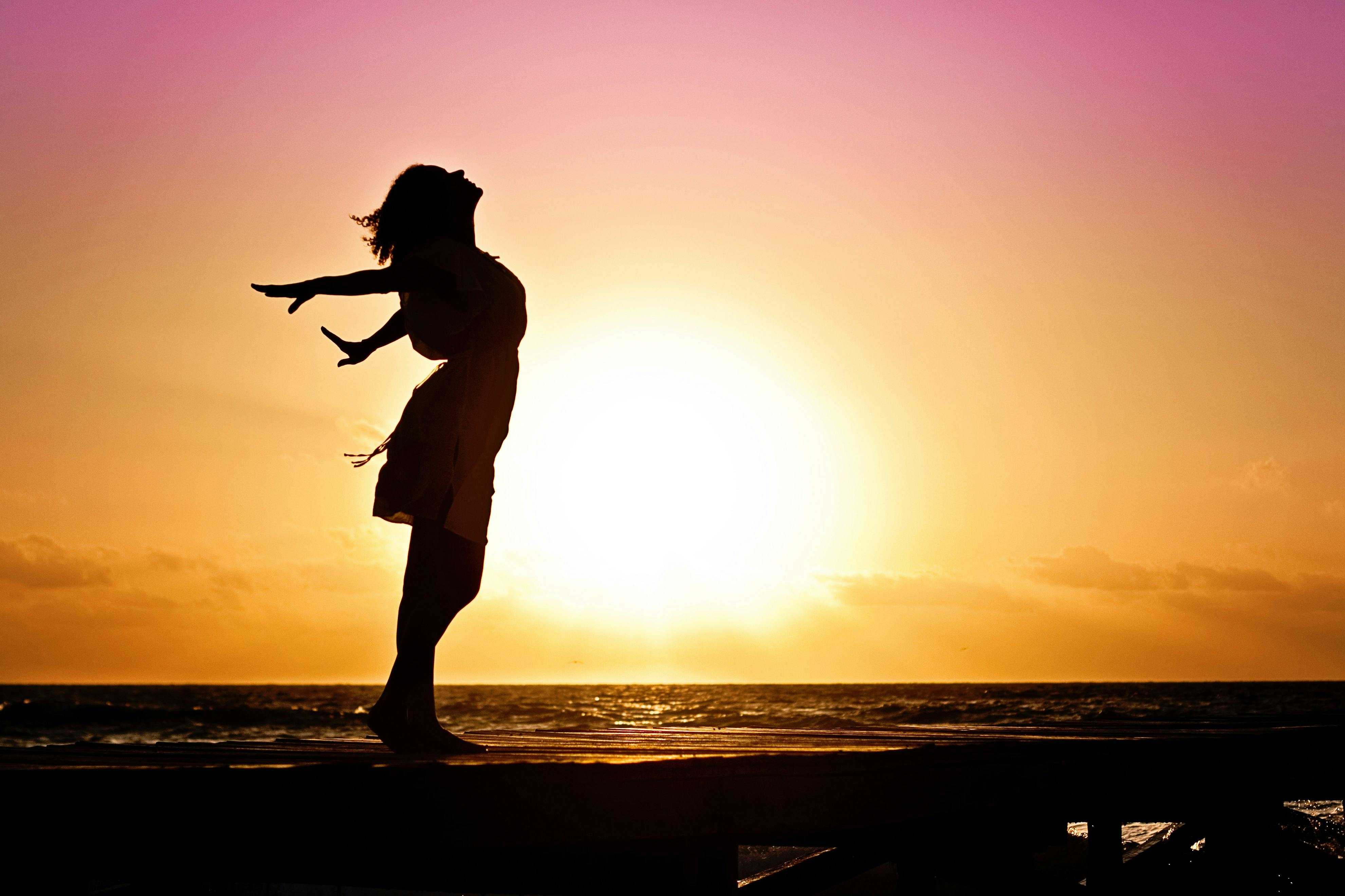 woman-happiness-sunrise-silhouette-40192