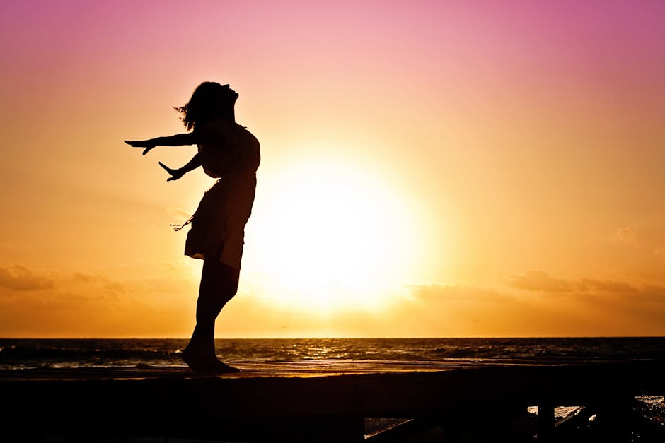 joy Essential OIl.  Lady in Beach Silhouette during Daytime Photography