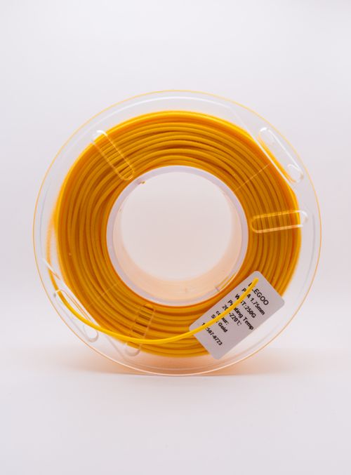 Free Close-up image of a yellow 3D printer filament spool isolated on a white background. Stock Photo