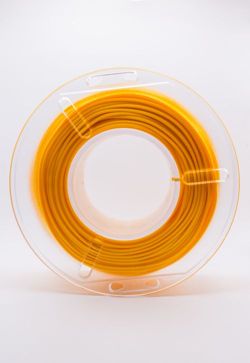 Free Bright yellow 3D printer filament spool isolated on white background for creative projects. Stock Photo