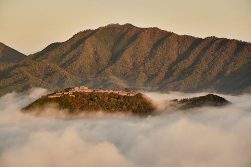 Free Brown and Green Mountains Under White Clouds Stock Photo