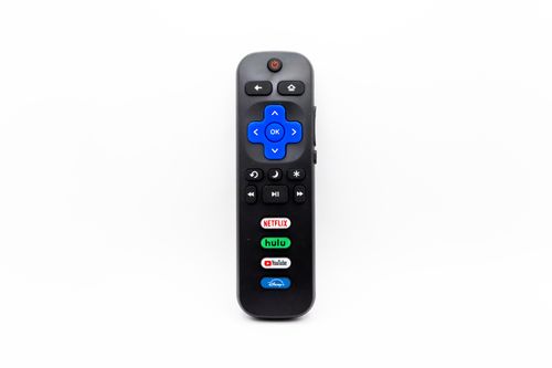 Free Universal remote control featuring buttons for Netflix, Hulu, YouTube, and Disney+. Stock Photo