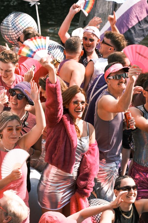 Free Colorful and festive crowd at the Amsterdam Canal Parade, showcasing vibrant diversity and joy. Stock Photo
