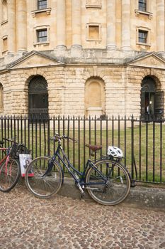 Bicycles parked in front of the historic Radcliffe Camera in Oxford, England.