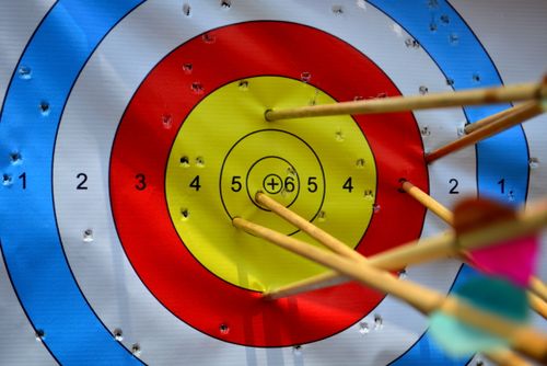 Free A vibrant archery target with arrows hitting the bullseye, showcasing precision and skill. Stock Photo