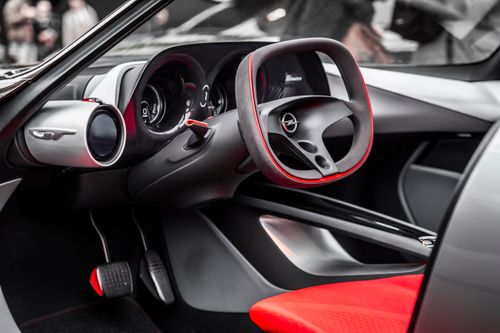 Free Explore this sleek car interior showcasing a futuristic steering wheel and dashboard design. Stock Photo