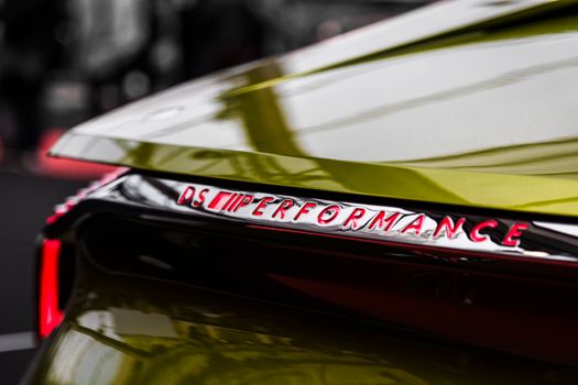 Detailed view of a DS Automobiles performance badge with a sleek design and vibrant colors.