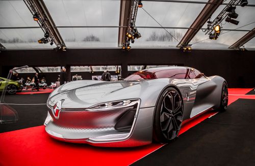 Free Sleek silver concept car displayed at an indoor automotive event showcasing modern design. Stock Photo
