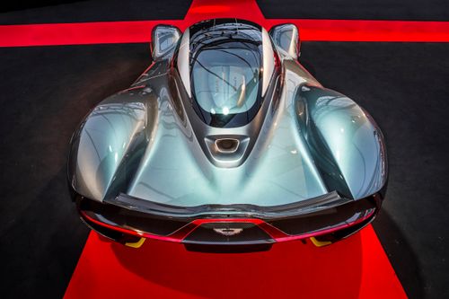Free Top view of a sleek sports car at an auto show, showcasing modern design and innovation. Stock Photo