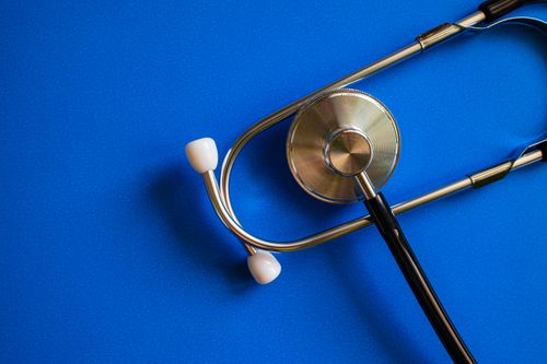 Free Stethoscope on blue background symbolizing healthcare and medical diagnosis. Stock Photo