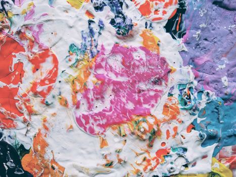 Explore vibrant abstract art with colorful paint texture featuring swirling hues.