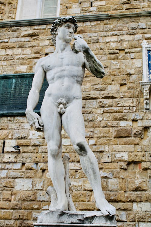 Statue Of Man Near Wall