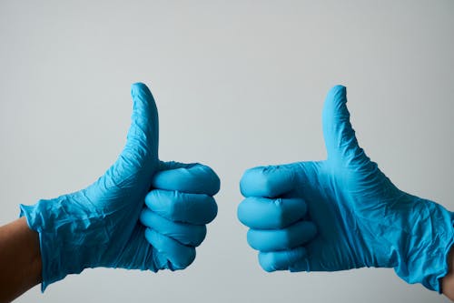 Persons Wearing Surgical Gloves