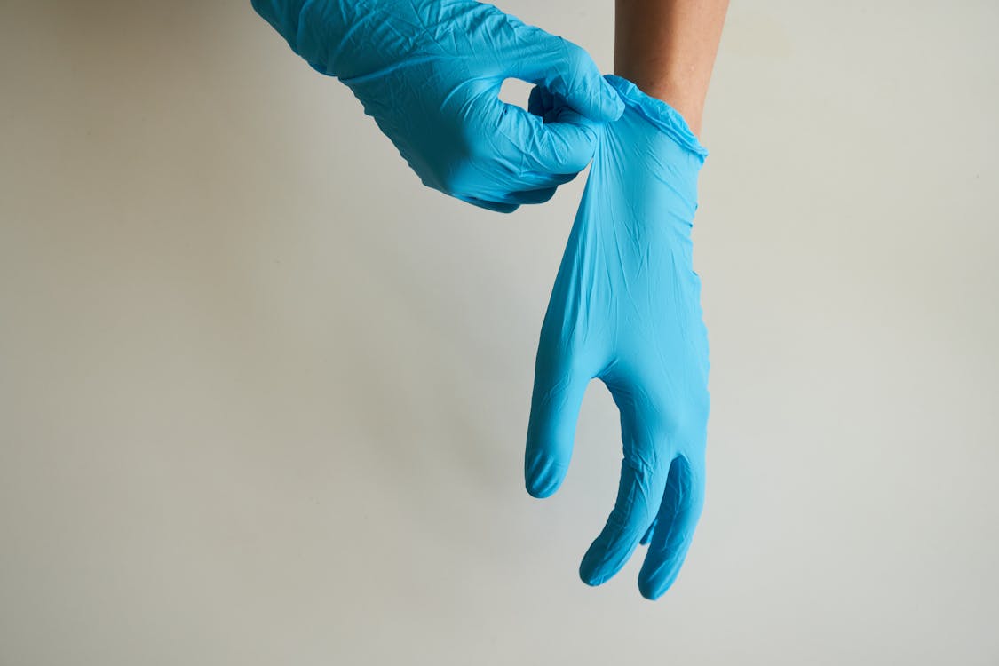 Free Person Wearing Blue Gloves Stock Photo