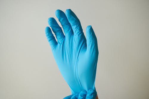 Free Person Wearing A Glove Stock Photo
