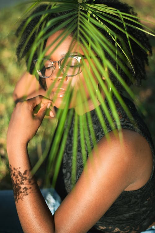 Woman In Black Top Wearing Eyeglasses