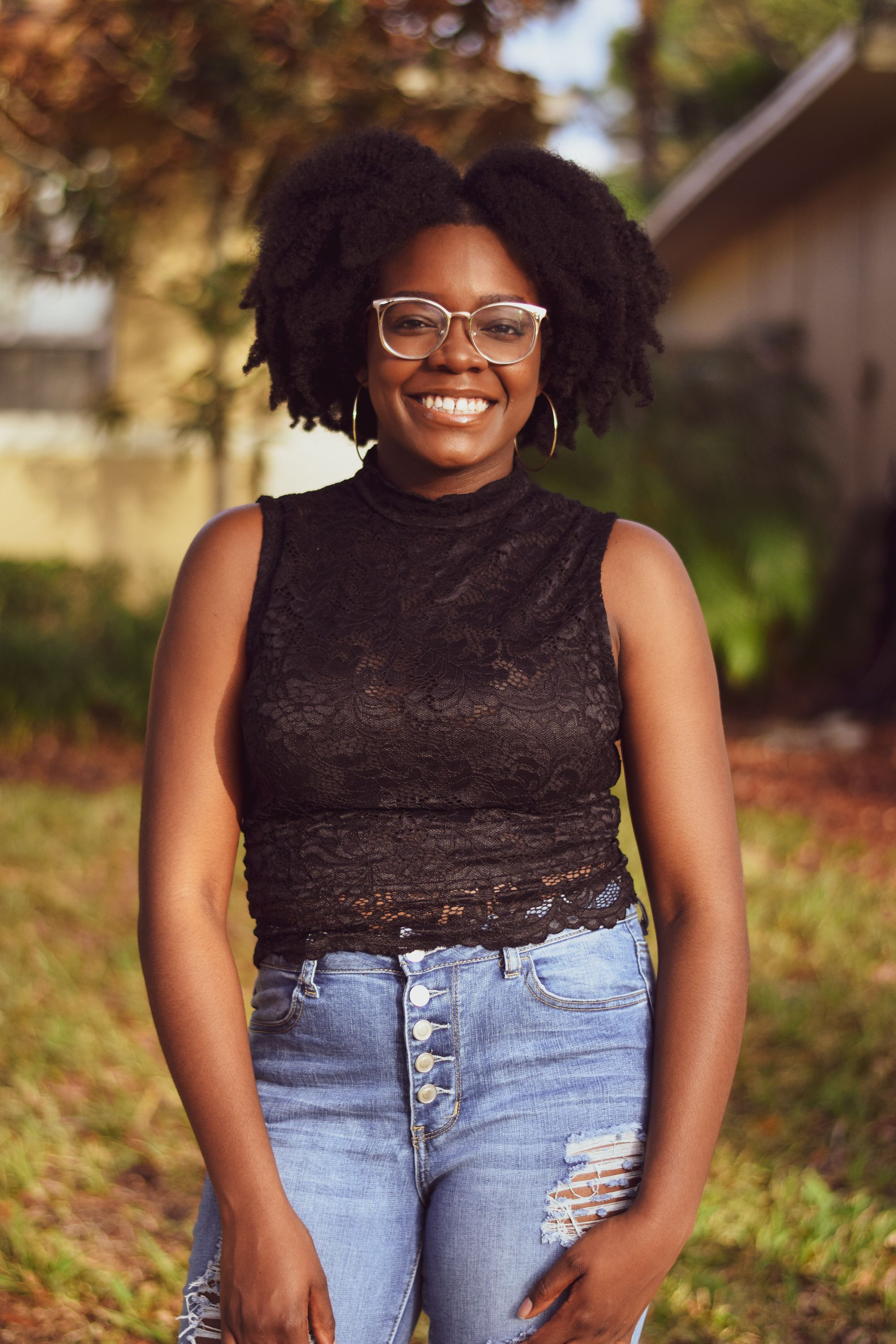 Woman In Black Top And Blue Denim Jeans · Free Stock Photo