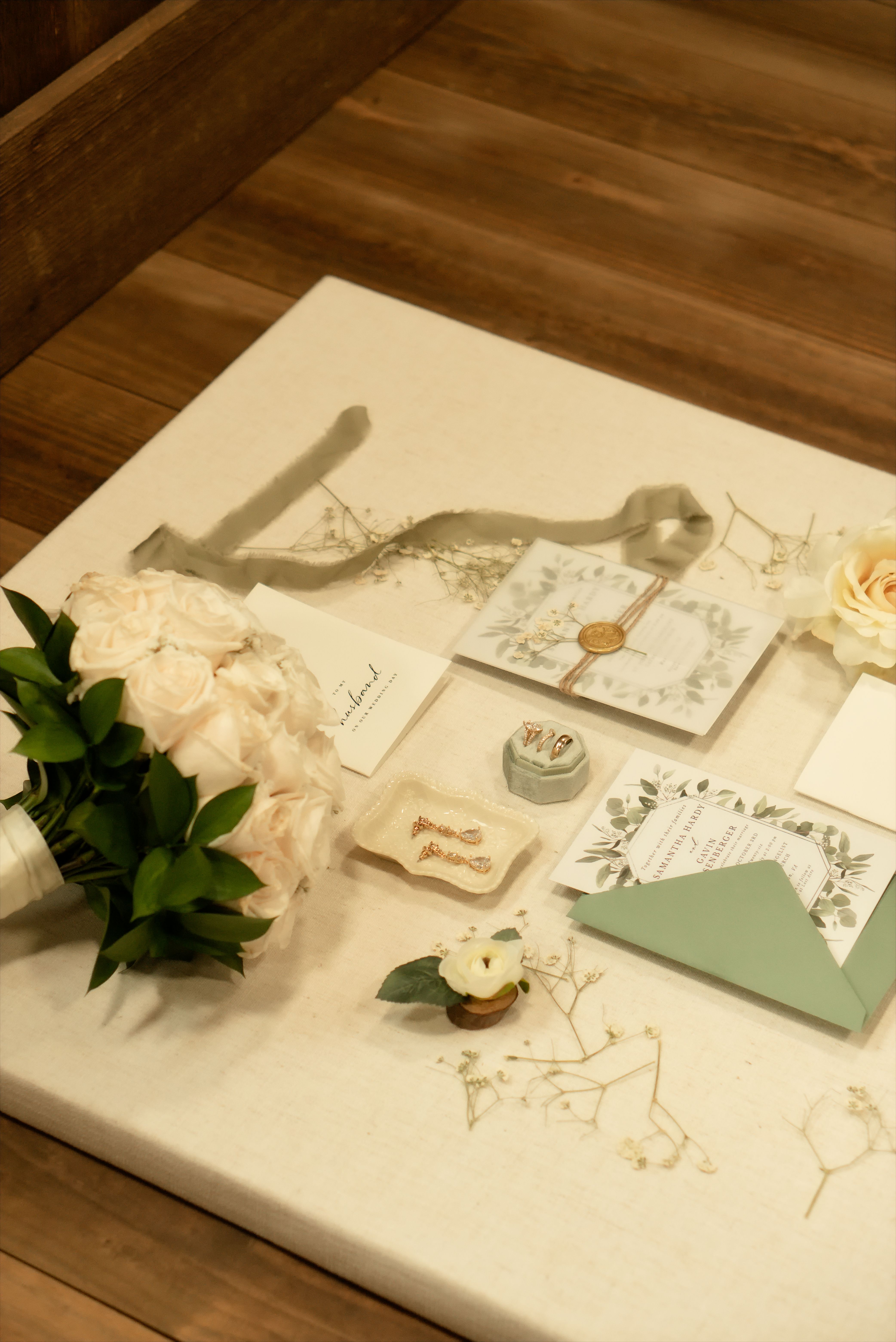 Elegant Wedding Invitation and Bouquet Setup · Free Stock Photo