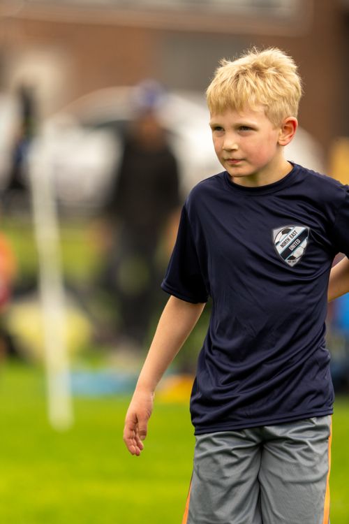 Free A young boy in a soccer jersey on a field in Brooklyn Center, Minnesota. Stock Photo