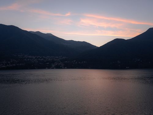 Free Beautiful sunset view over Lake Como with mountains in Lombardy, Italy. Stock Photo