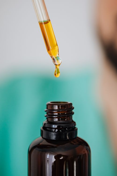 Close-Up of Dropper with Essential Oil Droplet · Free Stock Photo