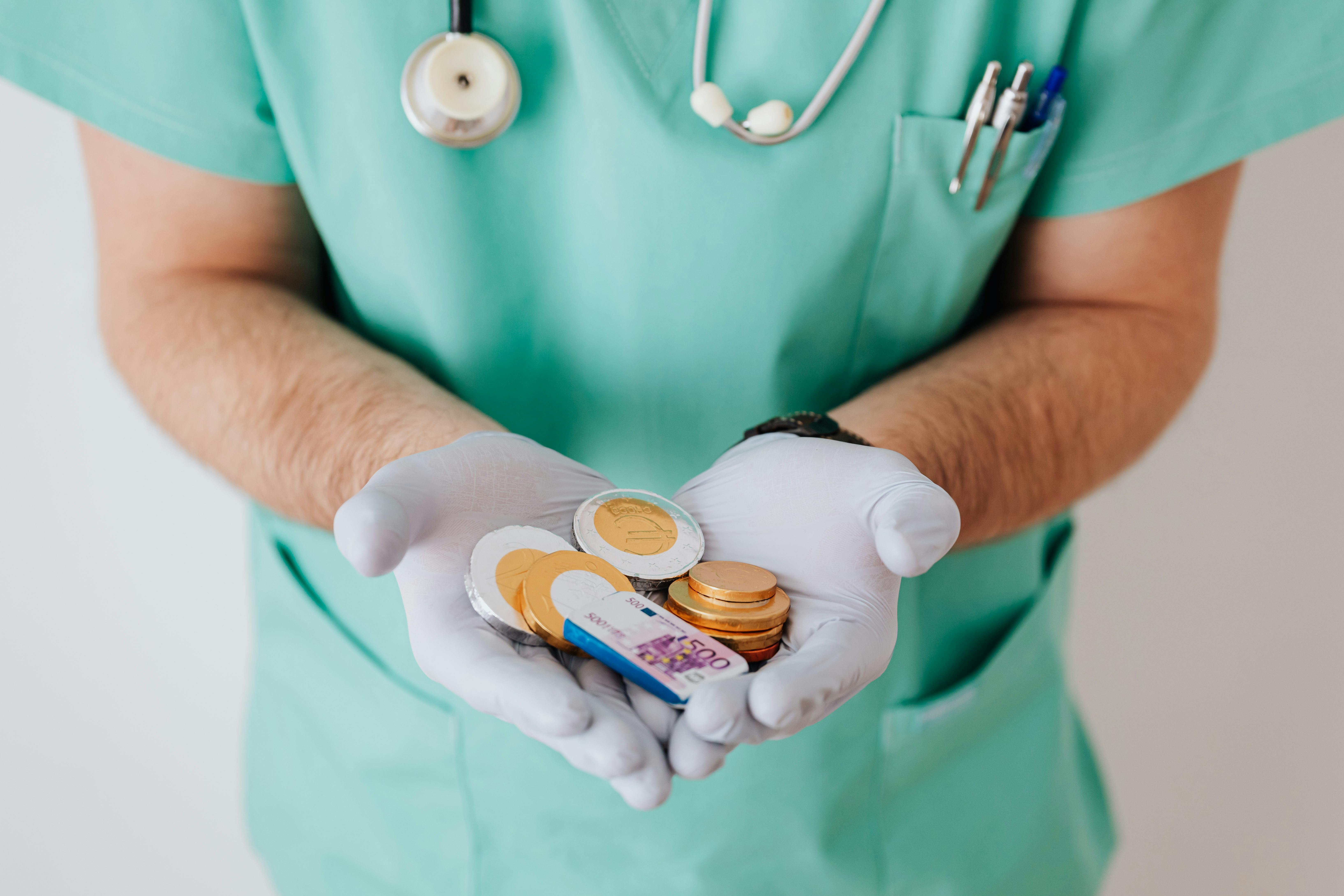 Doctor showing cash money in clinic · Free Stock Photo