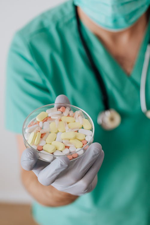 Free Crop doctor with stethoscope showing pills Stock Photo