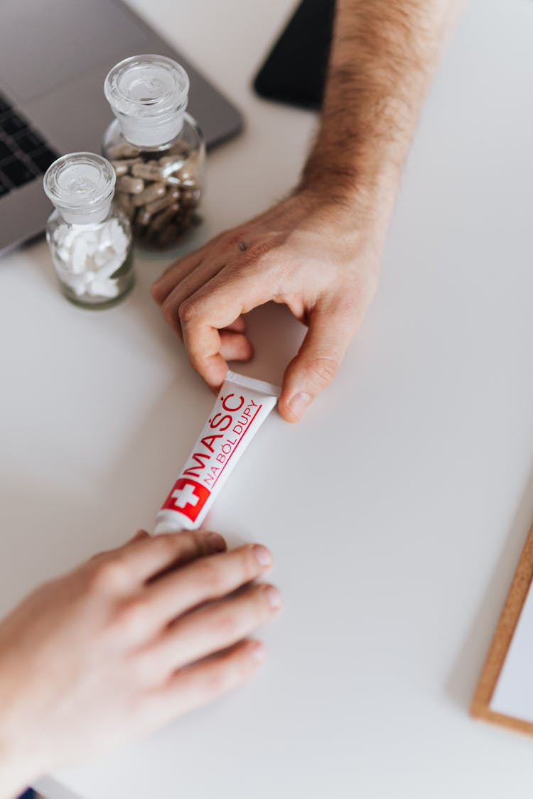 Handing Of Tube Of Ointment 