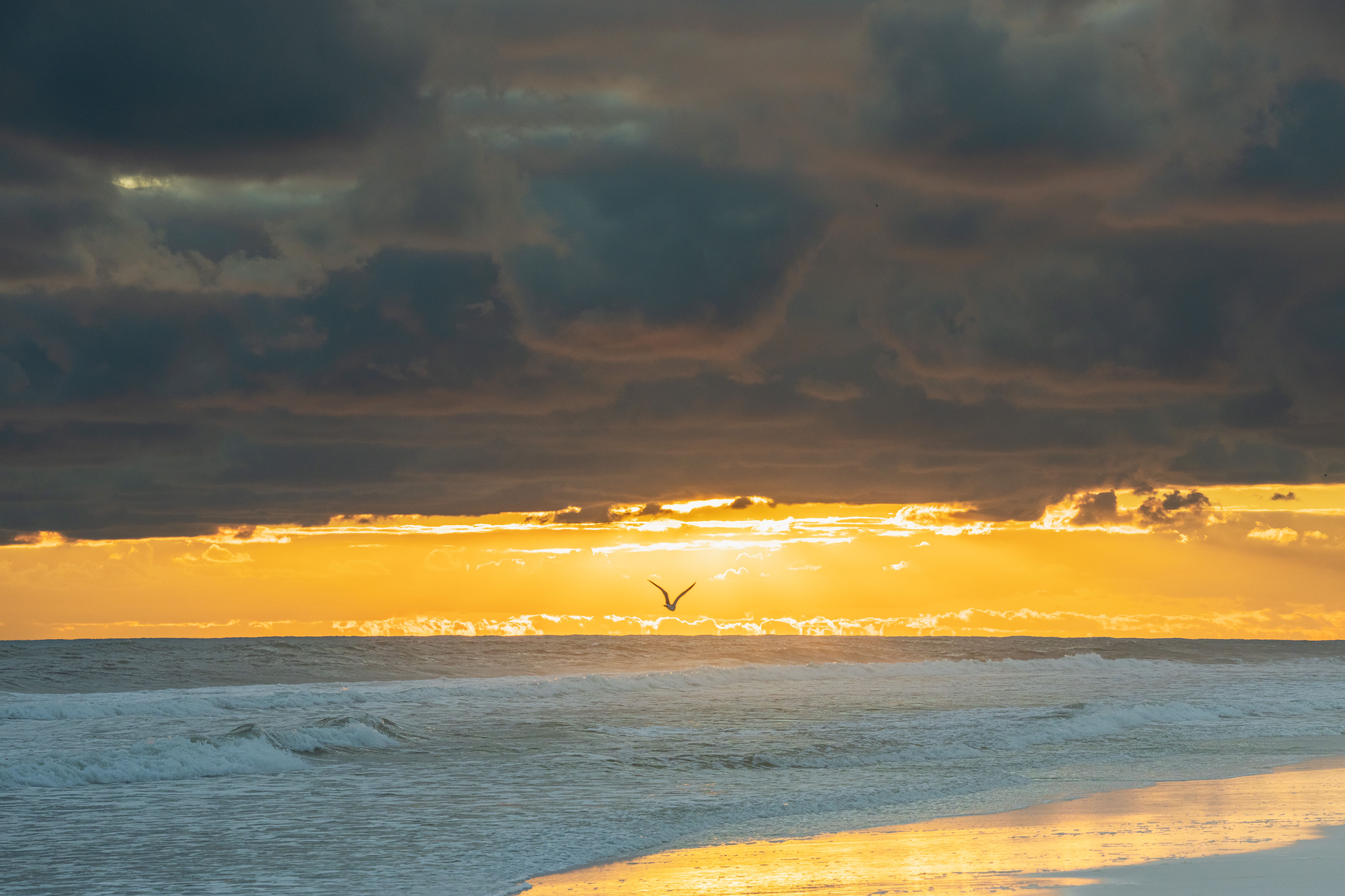 sunset over the white sand beach in Destin Florida Emerald Coast