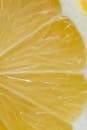 Macro texture of fresh lemon slice with ripe juicy pulp