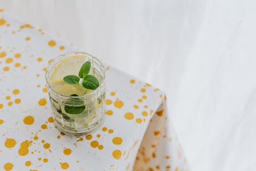 Glass of fresh cocktail on corner of table