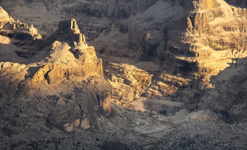 Free A breathtaking view of rugged mountains in the Dolomites, Italy, during sunset. Stock Photo