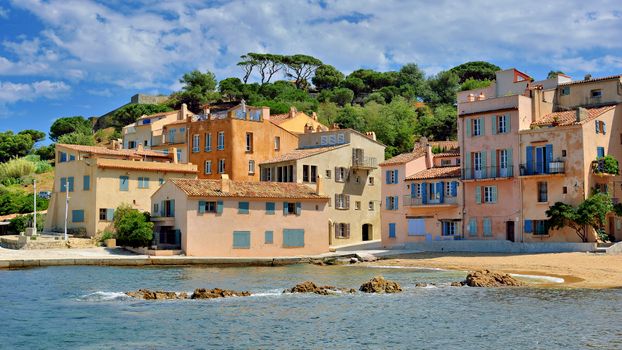 Beautiful seaside buildings in Saint-Tropez, France, showcasing colorful Mediterranean architecture.