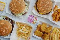 Various unhealthy food on marble table