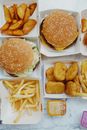Appetizing fast food on marble table