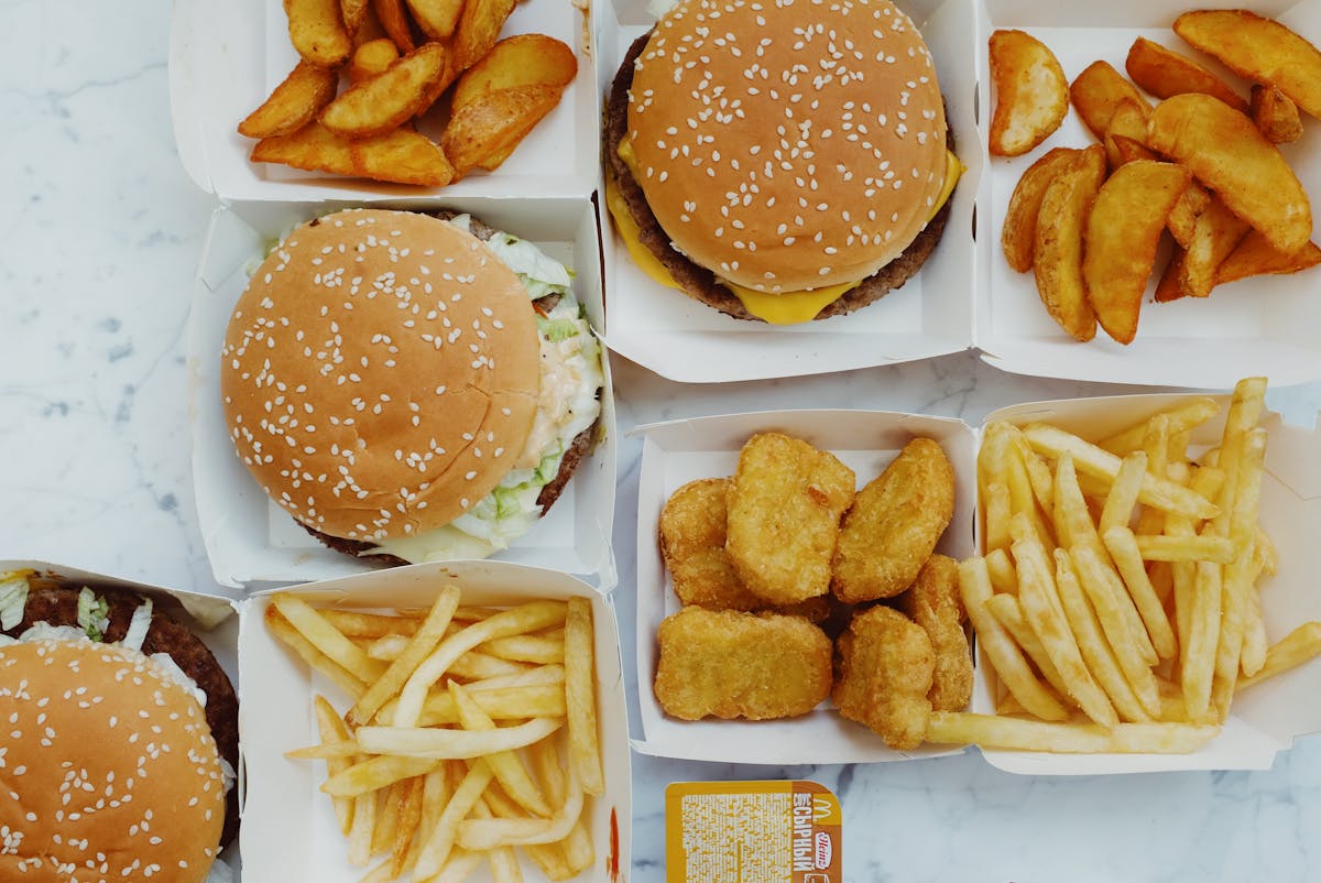Assorted small bowls with chopped vegetables, beans, and herbs ready to assemble