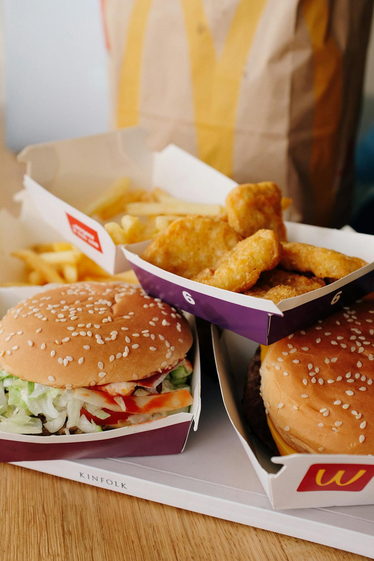 Small bowls filled with various fermented vegetables on a wooden table