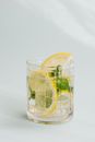 Glass of fresh drink placed on white background
