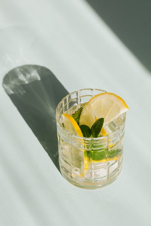 Mojito with mint and lemon on white background