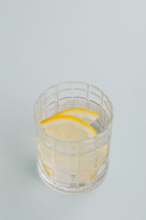 Glass of cold drink with lemon