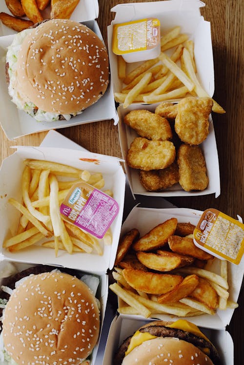 Tasty junk food on wooden table