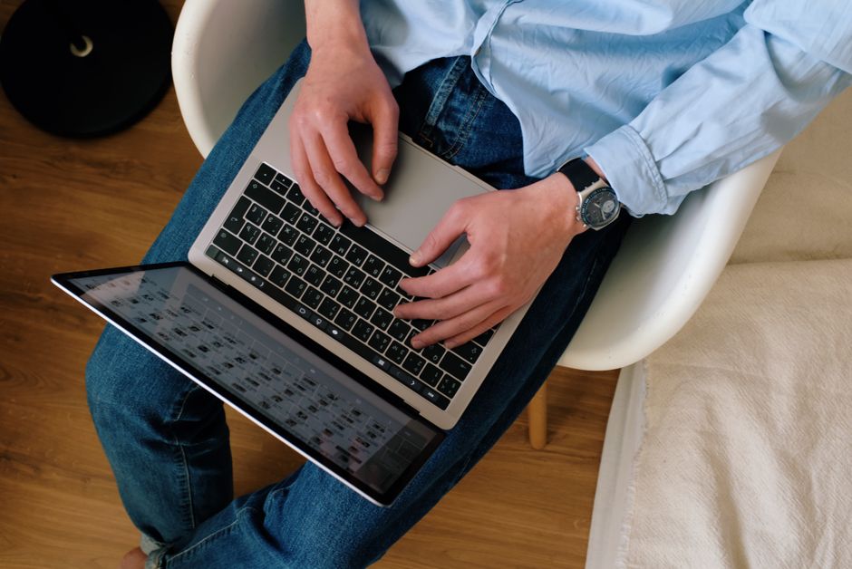 content writer reviewing ai generated text laptop
