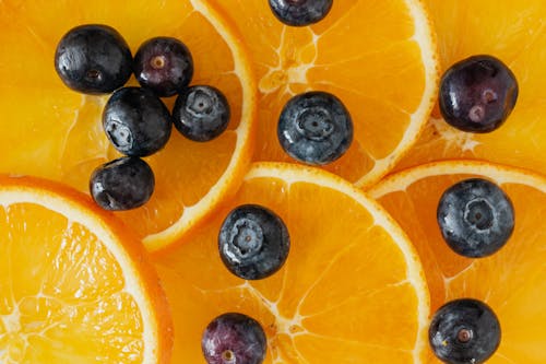 Blueberries placed on orange slices