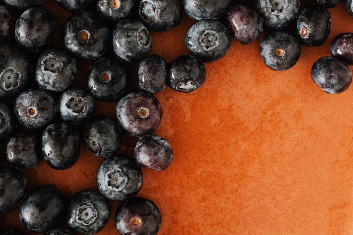 Heap of blueberries on table