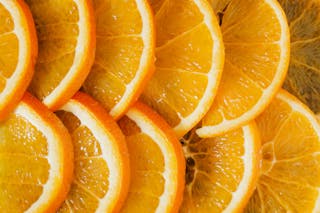Top view of delicious sliced oranges arranged near each other as minimalist background of organic nutrition