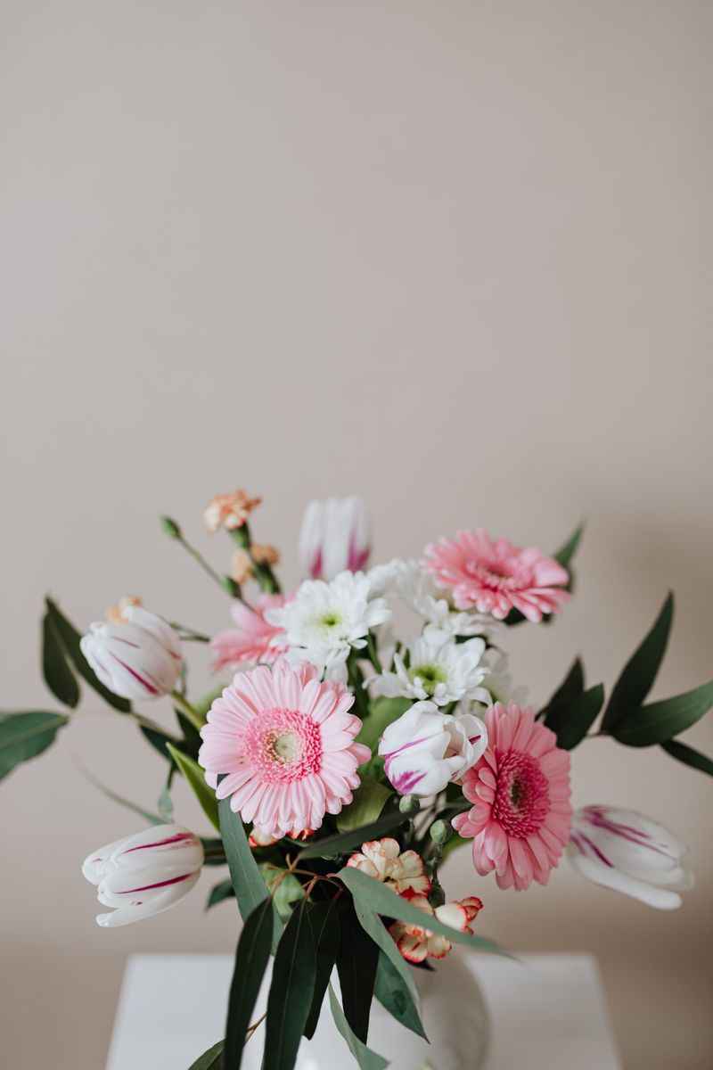 Tender flowers in ceramic vase
