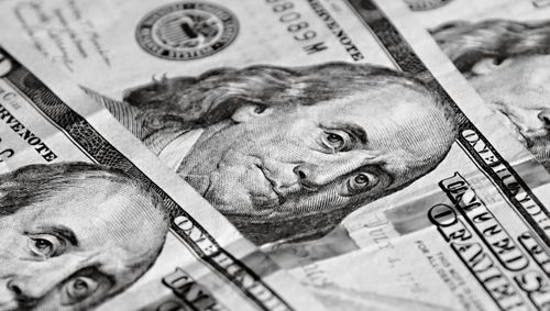 Free Detailed black and white close-up of one hundred dollar bills featuring Benjamin Franklin. Stock Photo