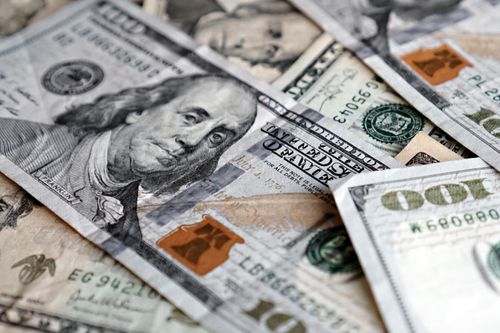 Free A detailed photo of US hundred dollar bills, showcasing Benjamin Franklin. Stock Photo