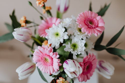 Bouquet of colorful flowers in white vase