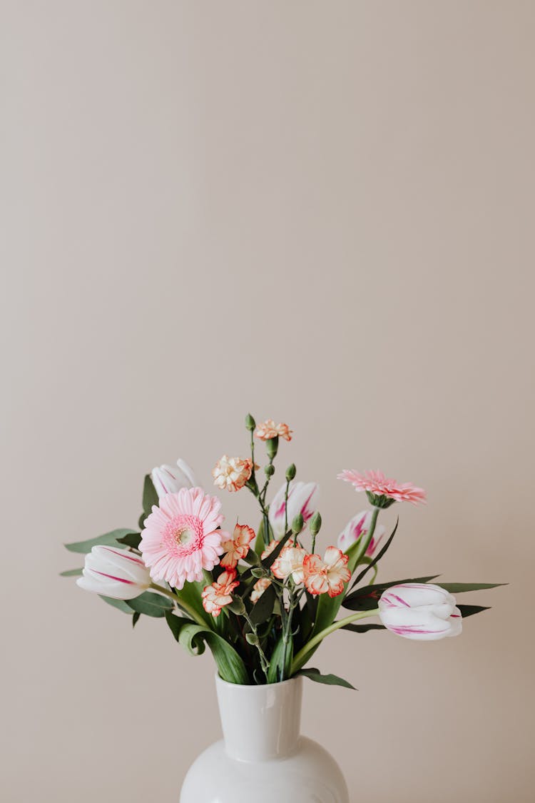 White Ceramic Vase With Fresh Flowers